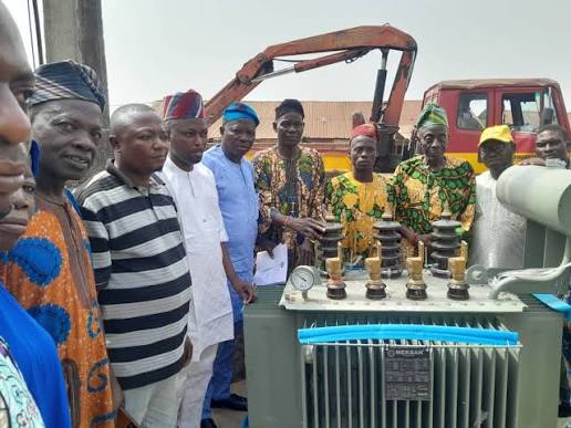Community leaders receiving electrical infrastructure